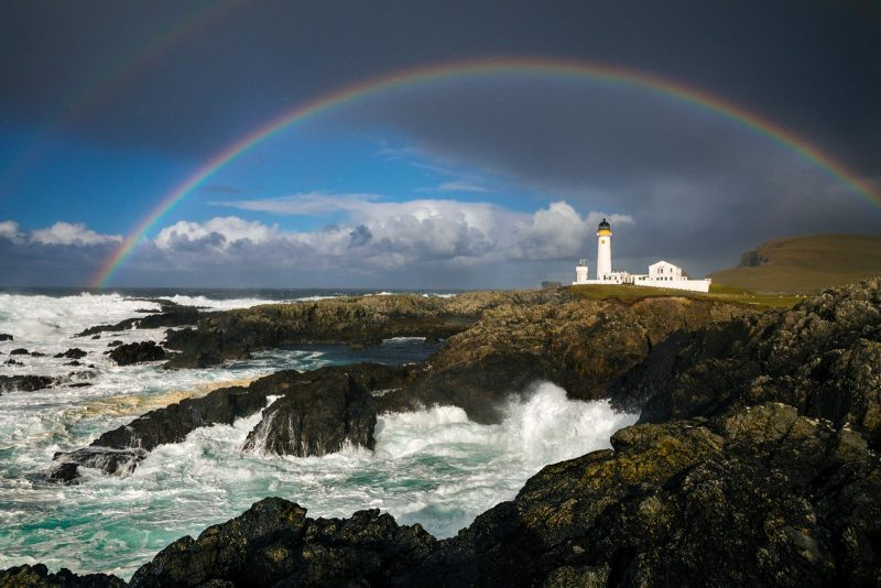 lighthouse and rainbow photograph